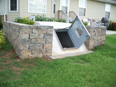 Underground Vaults for Sale | These storm shelters can be set into landscaping where the doors are ... Shelter Architecture, One Punch Man Wallpapers, Underground Storm Shelters, Building A Bunker, Tornado Gif, Underground Cellar, Storm Cellar, Doomsday Bunker, Tornado Shelter