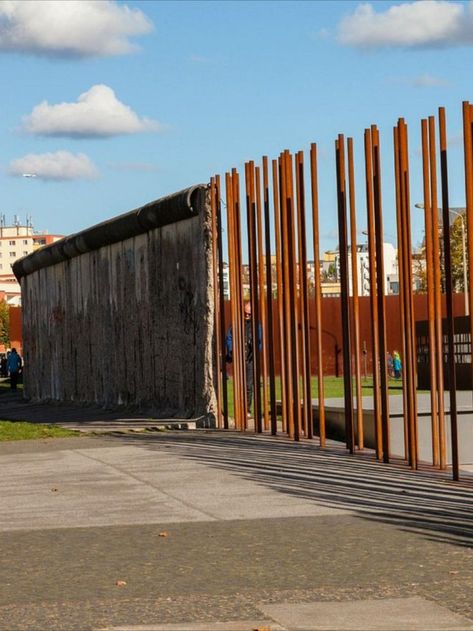 The memorial contains the last piece of the Berlin Wall with the preserved grounds behind it and is thus able to convey an impression of how the border fortifications developed until the end of the 1980s. The events that took place here together with the preserved historical remnants and traces of border obstacles on display help to make the history of Germany's division comprehensible to visitors. Find more places from Berlin by clicking on the link supporting this post History Of Germany, The Berlin Wall, Ancient Buildings, Berlin Wall, Historic Places, Modern Buildings, Hard Times, Places To See, Berlin