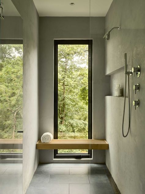 A modern bathroom with a window in the shower that frames the forest view. Home In The Forest, Robert Young, Window In Shower, Glass Stairs, Steel Stairs, Storey Homes, Bath Ideas, Garden Windows, Modern Shower