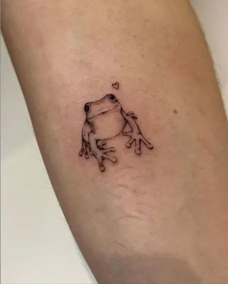 32 Fabulous Frog Tattoo Ideas For Men & Women Asian Frog Tattoo, Frog Minimalist Tattoo, Two Frogs Tattoo, Baby Frog Tattoo, Whites Tree Frog Tattoo, Peace Frog Tattoo, Witch Frog Tattoo, Frog Tattoo Matching, Cute Frog Tattoo Ideas