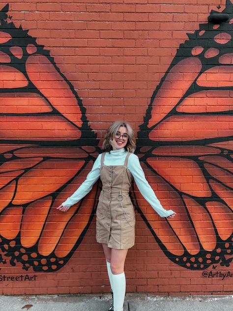 Pose With Butterfly, Butterfly Photoshoot Ideas, Butterfly Wings Photoshoot, Butterfly Shoot Photo Ideas, Wing Poses, Mural Poses, Hanging Butterfly Photoshoot, Butterfly Wings On Wall, Senior Picture Ideas Butterflies