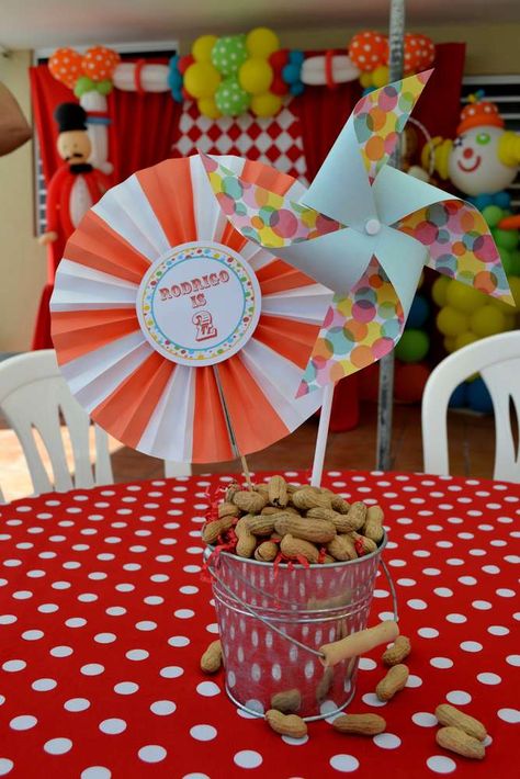 {Carnival Birthday} | CatchMyParty.com Carnival Tablescape, Carnival Birthday Centerpieces, Carnival Table Decorations, Peanut Centerpiece, Carnival Centerpieces, Circus 1st Birthdays, Circus Birthday Party Theme, Tin Buckets, Birthday Party Table Decorations