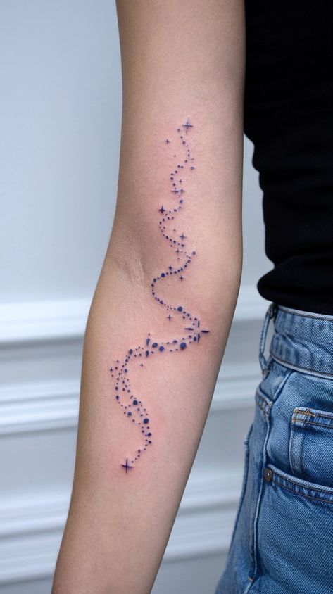 10 Magical Shooting Star Tattoo Ideas With Sparkles - Dainty Galaxy Tattoo, Star Trail Tattoo, Glitter Tattoo Permanent, Trail Tattoo Ideas, Trail Tattoo, Starlight Tattoo, Star Tattoo Ideas, Star Tattoos For Men, Shooting Star Tattoo