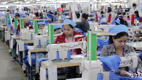 Garment workers sew clothes at Grand Twins International Factory earlier this year.  Vireak Mai Bodies Exhibit, International Workers Day, Factory Worker, Workers Day, Garment Workers, Clothing Factory, Garment Factory, Garment Industry, 2024 Vision