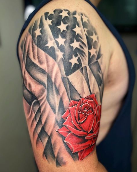 Shoulder American Flag Tattoo With A Rose American Flag Tattoo Design, We The People Tattoo, Flag Tattoo Design, People Tattoo, Patriotic Tattoos, Rose Tattoos For Men, Saved Tattoo, Flag Tattoo, Stomach Tattoos