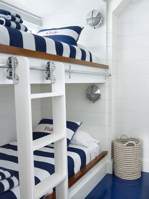 White and blue nautical themed bunk room features two-toned built-in bunk beds fitted with white ladders on rails and dressed in blue awning striped bedding with embroidered matching shams. Bunk Lights, Quad Bunk Beds, Bunk Bed Rail, Pastel Bathroom, Colorful Rooms, Bunk Bed Room, Bunk Bed Rooms, Stripe Bedding, House Bunk Bed