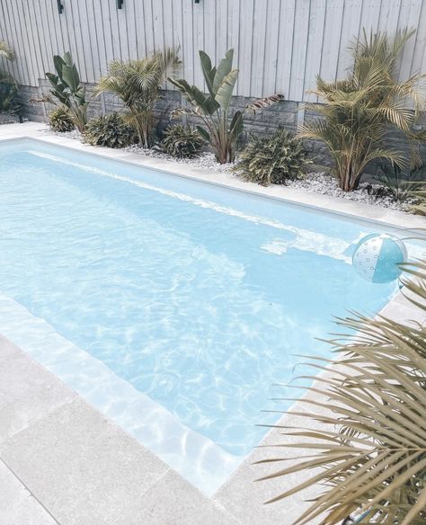 White Pools Outdoor, White Rocks Around Pool, Pool White Fence, White Fibreglass Pool, White Pool Area, White Fiberglass Pool, White Concrete Pool, Coastal Pool Area, All White Pool