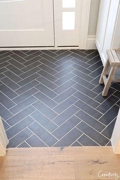 Black Herringbone Tile Entryway, Herringbone Tile Front Entrance, Kitchen Flooring Ideas Next To Hardwood, Herringbone Tile Hearth, Kitchen Floor Herringbone Tile, Charcoal Herringbone Tile Floor, Black Modern Farmhouse Bathroom, Foyer Floors Ideas Entryway, Slate Tile Laundry Room