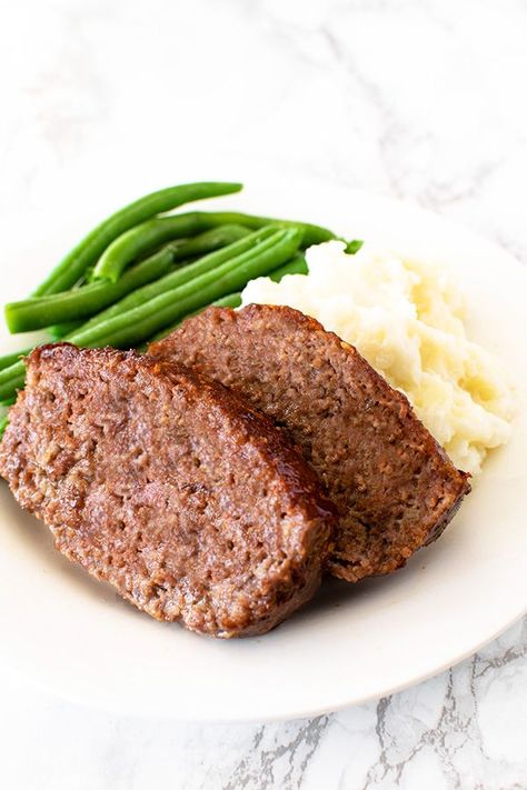 This classic meatloaf is made without eggs and is moist and delicious. Serve with mashed potatoes and green beans for an easy dinner! #thetasteofkosher #eggless #dairyfree #meatloaf #dinner Dairy Free Meatloaf, Meatloaf Without Eggs, Meatloaf Oatmeal, Oatmeal Dinner, Meatloaf With Oatmeal, Mashed Potatoes And Green Beans, Gluten Free Meatloaf, Dairy Free Recipes Easy, Meatloaf Dinner