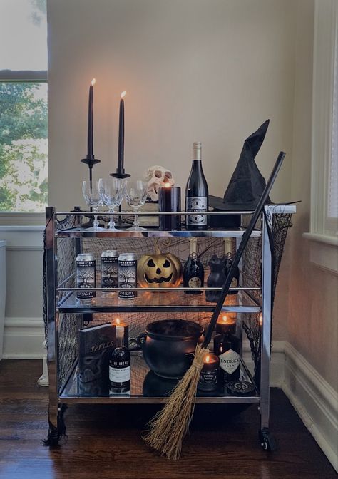 halloween bar carr witch decor Skeleton Pushing Bar Cart, Halloween Drink Cart, Halloween Bar Cart Ideas, Spooky Witch Aesthetic, Spooky Bar Cart, Halloween Bar Cart Decor, Halloween Island Decor, Witchy Dinner, Halloween Drink Station