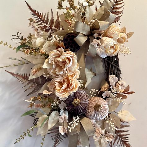 Product Description: Embrace the cozy vibes of autumn with this exquisite Fall Boho Wreath, a perfect blend of rustic elegance and bohemian charm. Handcrafted with attention to detail, this wreath features a stunning mix of soft blush-toned peonies, delicate ferns, and velvet pumpkins in muted, earthy tones. The natural elements, including dried foliage and a ribbon in neutral shades, create a harmonious balance that effortlessly brings the beauty of the season into your home. Perfect for your front door or as an interior accent, this wreath invites the warmth and tranquility of fall into any space. If placing the wreath outdoors, please provide protection from the elements with a covered porch or overhang. Please remember the sun will fade anything and everything over time. *Please be sur Boho Fall Wreath, Fall Wreath Ideas, Bohemian Wreath, Boho Chic Fall, Elegant Fall Wreaths, Gift Wreath, Boho Wreath, Fall Decor Diy Crafts, Autumn Wreaths For Front Door