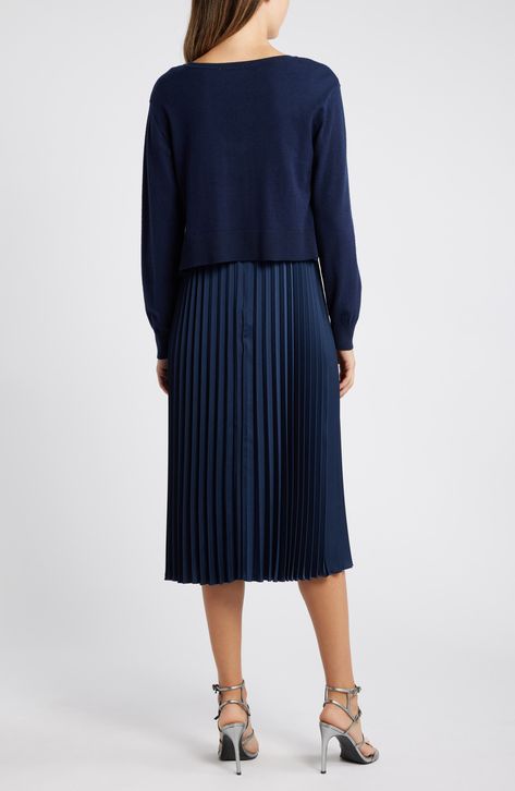 Achieve a layered look in this sophisticated set featuring a polished V-neck sweater and a gracefully moving pleated skirt. Sweater has V-neck; long sleeves; ribbed cuffs and hem Sweater is 48% rayon, 31% polyester, 21% nylon; skirt is 100% polyester Dry clean Imported Navy Polka Dot Skirt, Pleated Skirt And Sweater, Nylon Skirt, Blue Pleated Skirt, Skirt Sweater, Sweater Skirt Set, Navy Skirt, Hem Sweater, Polka Dot Skirt