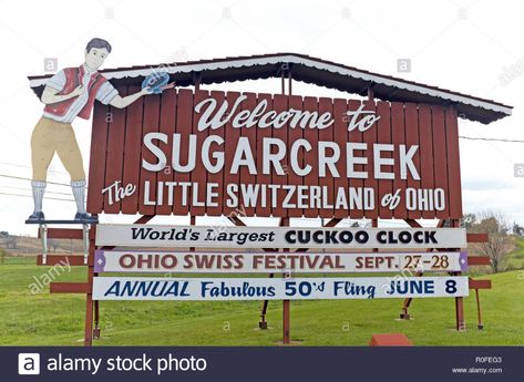 A 'Welcome to Sugarcreek: The Little Switzerland of Ohio' sign welcomes travelers to the Ohio Amish country town of Sugarcreek. Stock Photo Ohio Amish Country, Amish Country Ohio, Sugarcreek Ohio, Ohio Travel, Vacation Usa, Amish Country, Oh The Places Youll Go, Worlds Largest, Switzerland