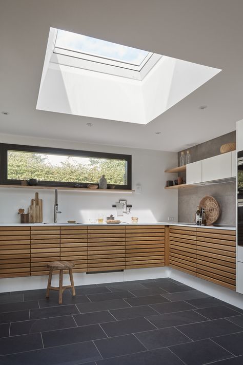 Use a huge skylight or VELUX roof window when designing your kitchen extension to really maximise light in the space. Single storey extensions really benefit from the most daylight, particularly for a kitchen diner.  #VELUX #skylights #kitchenreno #kitchenextension #extensions Roof Window Ideas, Velux Windows Kitchen, Roof Windows Kitchen, Natural Lighting Design, Skylight Design, Skylight Kitchen, Velux Skylights, Velux Windows, Roof Windows