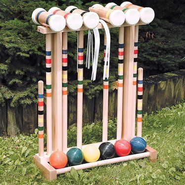 BENEFITS OF OUR WOODEN CROQUET SETS Our Amish-made maple croquet set is perfect for Sunday afternoons in the backyard or a picnic with family and friends. Made of solid maple, these outdoor wooden croquet sets are durable and a great addition to your summer events. Start a new tradition this year with a friendly or competitive croquet tournament with family and friends. Durable and beautiful mallets (25-1/2L) are made of solid maple Rubber end caps protect mallets from splitting Picnic With Family, Croquet Set, Amish Crafts, Outside Games, Outdoor Game, Yard Games, Lawn Games, Backyard Games, Family Outdoor