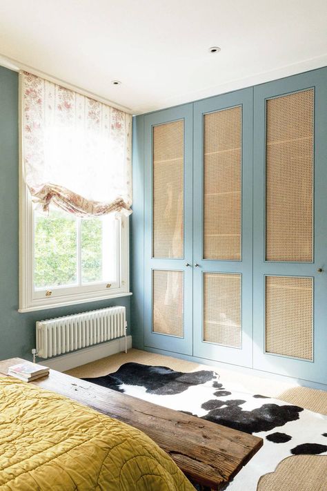 [i]In the spare bedroom, Matilda removed the panels from the built-in wardrobe doors and stapled cane to the back of them[/i] Built In Wardrobe Doors, British Decor, Ceiling Storage, Farmhouse Side Table, Wicker Decor, غرفة ملابس, Hus Inspiration, Bedroom Wardrobe, Spare Bedroom