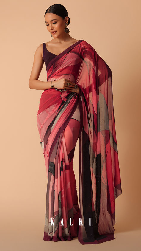 Look and feel you best this festive season in this colorful addition. Fashioned from high-quality and feel-good satin fabric, this drape is decked with mesmerising abstract prints. Elevated with embellished stones all-over, it is completed with an unstitched blouse piece. A stellar pick for glamorous soirées, this drape will promises a showstopper look. Abstract Saree, Print Saree, Printed Sarees, Ethnic Wear, Blouse Piece, Festive Season, Abstract Prints, News Design, Abstract Print