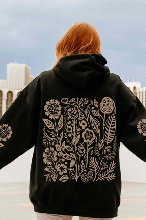 Embrace your inner granola girl with this cozy brown wildflower hoodie! Perfect for outdoor adventures or lounging in style. 🌿 #GranolaGirl #WildflowerHoodie Painting On Sweater, Bleaching Hoodie, Hoodie Painting Ideas, Hoodie Embroidery Ideas, Hoodie Painting, Granola Girl Aesthetic Outfits, Painted Hoodie, Blowfish Boots, Bleached Hoodie