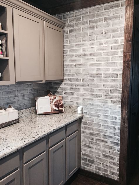 Lowes brick panels painted white. Brick backsplash. Paint color- studio taupe by Behr faux brick Brick Tiles Kitchen, Brick Kitchen Wall, Diy Faux Brick Wall, Faux Brick Backsplash, Brick Backsplash Kitchen, Brick Wall Paneling, White Brick Wall, Farmhouse Backsplash, Brick Interior