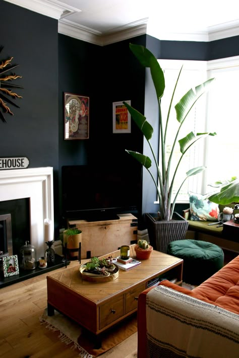 HOW TO WEAR KICK FLARES Black Wall Fireplace, Living Room Black Wall, Dark Walls Living Room, Moody Bohemian, Decoration Plants, Wall Fireplace, Apartment Decorating Living, Dark Living Rooms, Living Room Black