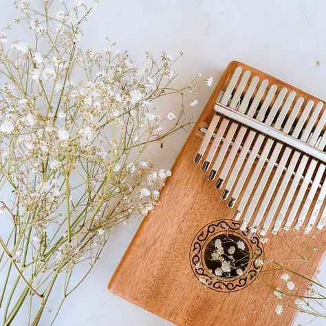 #Kalimba #aesthetic #flowers#music Kalimba Pictures, Marimba Aesthetic, Kalimba Aesthetic, Musical Instruments Aesthetic, Aesthetic Instruments, Teen Doctor, Thumb Piano, Aesthetic Flowers, 8th Sign