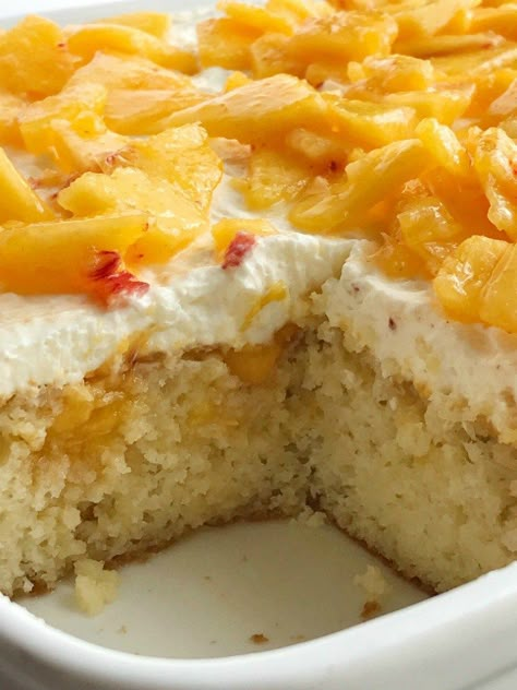 Peaches and Cream Poke Cake | Poke Cake Recipe | Cake | Dessert | If you love poke cakes then you must try this peaches and cream poke cake! French vanilla cake soaked in fresh peaches, frosted with a light and fluffy cream cheese whipped topping, and topped with chunked fresh peaches. #pokecake #cake #dessertrecipes #easydessertrecipe #peaches #peachrecipes Heavenly Summer Peach Cobbler Poke Cake, Peach Poke Cake, Peaches And Cream Cake, Cream Poke Cake, Peach Cake Recipes, Cake Poke, Banana Cake Recipes, French Vanilla Cake, Cake Mix Ingredients