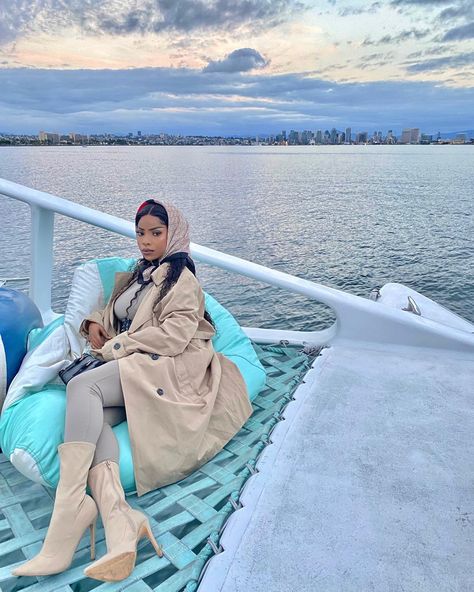 Black luxury, Evening Boat ride! high fashion outfit paired with a nude trench coat, nude booties and a Gucci head scarf! @Magggiemae_ on instagram Fall Boat Ride Outfit, Winter Boating Outfit, Gucci Head Scarf, Boat Ride Outfit, Nude Boots, Nude Outfits, Boating Outfit, High Fashion Outfits, Boat Ride