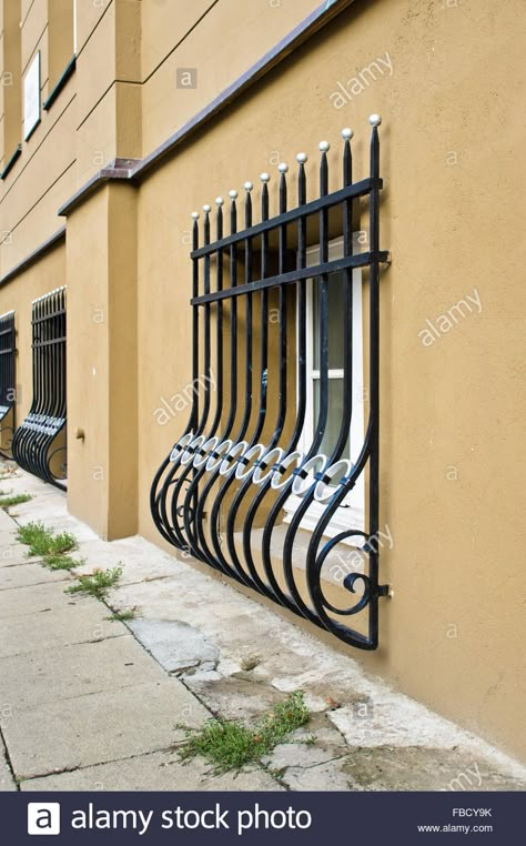 Download this stock image: Wrought iron window bars on the exterior of an urban building at street level - FBCY9K from Alamy's library of millions of high resolution stock photos, illustrations and vectors. Iron For Windows, Window Grill Design Modern Window Grill Design Modern Architecture, Window Tattoo Design, Wrought Iron Window Grill, Window Seating Ideas, Window Tattoo, Wrought Iron Window, Iron Window Grill, Modern Window Grill