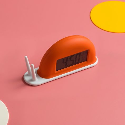 Upgrade your bedside with the Snail Alarm Clock Night Light. This innovative alarm clock doubles as a night light, making it perfect for your child's room or a soft addition to your bedroom. The cute snail design adds a playful touch while the alarm clock feature ensures you wake up on time. Please Note: An order is 5 lamps. Please Note: The dimensions of this lamp are very small, only about the size of a palm. Purchase Notes: Only supports shipping to Japan, Australia, the EU, and the United St Cool Alarm Clock, Cute Digital Clock, Cute Snail, Small Clock, Orange Home Decor, Orange House, Light Building, Redecorate Bedroom, Deco Furniture