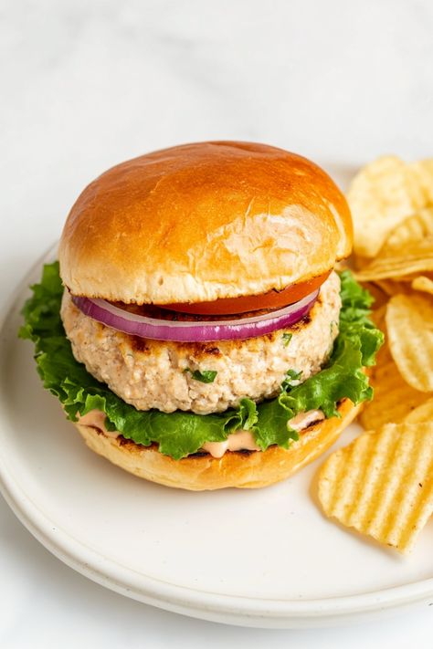 Delight your taste buds with these flavorful ground chicken burgers that are juicy and packed with deliciousness! Whether you're grilling up a storm or looking for a quick and easy meal idea, these burgers are the perfect choice. Elevate your burger game with this simple yet satisfying recipe that will surely become a family favorite. Enjoy them on their own or stack them high with all your favorite toppings for a mouthwatering experience. Easy Ground Chicken Recipes, Homemade Chicken Burgers, Chicken Burger Recipe, Ground Chicken Burgers, Chicken Burgers Recipe, Cow Cheese, Comfort Casseroles, Ground Chicken Recipes, Red Onion Salad