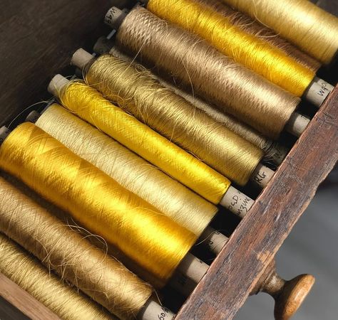 Yarn windings like these are all labelled with specific 'dye numbers' which hold the key ingredients needed to replicate their exact colour. We love the beautiful golden hues of this organzine  #gainsboroughweaving #design #colour #gold #metallic #yarn #silk #luxury #bright Golden Thread Aesthetic, Elegant Gold Silk Thread Sets, Gold Unstitched Art Silk Embroidered Fabric, Gold Embroidered Silk Thread Sets, Gold Embroidered Fabric With Silk Thread, Greek Aesthetic, Gold Yarn, Textile Factory, Metallic Yarn