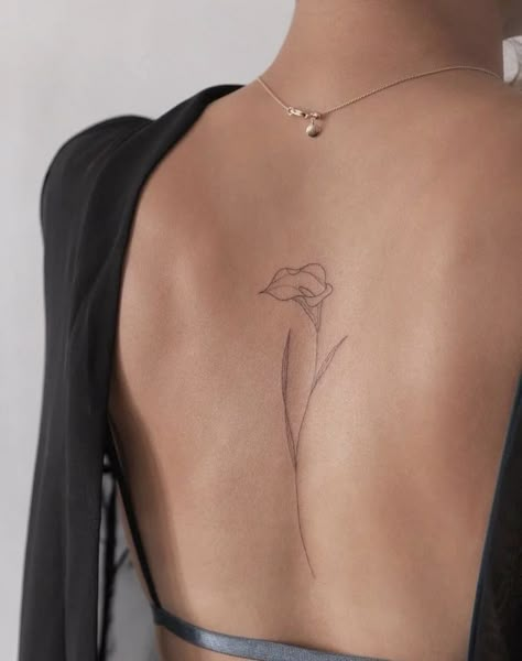 Womens Simple Back Tattoos, Calla Lily Spine Tattoo, Dainty Hip Bone Tattoo, Spine Leaves Tattoo, Small Tattoos Inside Arm, Single Flower Spine Tattoo, Minimalist Tattoo On Back, Simplistic Back Tattoos, Dainty Flower Back Tattoo