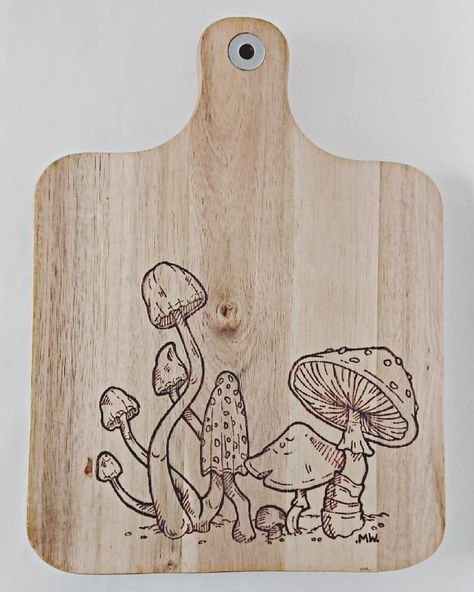 🍄 Mushroom chopping board 🍄 Hand burnt mushroom illustration on acacia wood chopping board 🏷️ SOLD . . . #woodworking #woodburn #pyography… Wood Burning Mushroom Art, Woodburning Mushroom, Wood Burning Chopping Board, Wood Burning Craft Ideas, Mushroom Wood Burning, Simple Wood Burning Patterns, Transfer Images To Wood, Mushroom Illustration, Woodburning Ideas