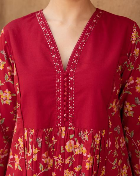 RUDHIRA - New Arrivals! Comfortable and flattering, this lively floral print is striking with a touch of artistry. Delicate hand embroidery at the neckline and matching fabric ghundis enhance its traditional appeal. [ Cottons Jaipur, Cotton, Kurta, Dress, New Arrivals] #cottons #cottonsjaipur #newarrivals #newcollection #everyday #essentials #dailyfits #comfort #cottonkurtas #breathablefabric #kurta #handcrated #red #sage #solid #monochrome #cottonsuits #daywear #shoponline #shopnow Cotton Wardrobe, Cottons Jaipur, 2025 Summer, Red Sage, Frocks Design, Churidar Designs, Trendy Shirt Designs, Handloom Fabric, Salwar Designs