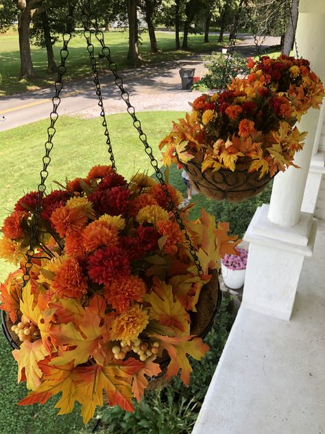 Fall Outdoor Hanging Basket Ideas, Front Porch Hanging Baskets Winter, Artificial Fall Hanging Baskets, Fall Hanging Baskets Diy, Hanging Fall Plants, Fall Outdoor Hanging Baskets, Fall Hanging Basket Ideas Front Porch, Hanging Baskets For Fall, Fall Porch Hanging Baskets