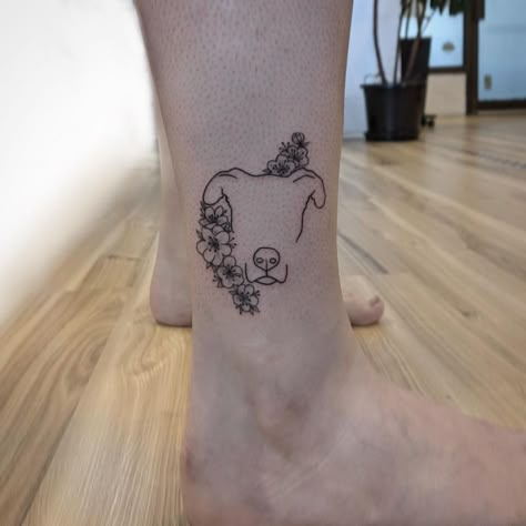 Dog Silhouette Tattoo With Flowers, Half Dog Face Half Flower Tattoo, Dog In Flowers Tattoo, Dog Outline Flower Tattoo, Half Dog Half Flower Tattoo, Wildflower Dog Tattoo, Fine Line Pitbull Tattoo, Dog Tattoos With Flowers, Fine Line Pet Portrait Tattoo