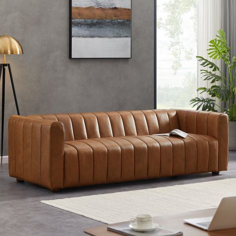 Style/Type Contemporary Mid-Century Modern Sofa General Dimensions 27"H x 88"W x 34.5"D Seat Height 18" Seat Depth 24" Arm Height Weight (lbs) 122 Upholstery Color Cognac Leather Materials Top-grain genuine leather, solid wood base, kiln dried Eucalyptus wood, high density foam Mid Century Modern Leather Sofa, Tufted Leather Sofa, Grey Leather Sofa, Top Grain Leather Sofa, Genuine Leather Sofa, Modern Leather Sofa, Tufted Leather, Tufted Sofa, Leather Couch