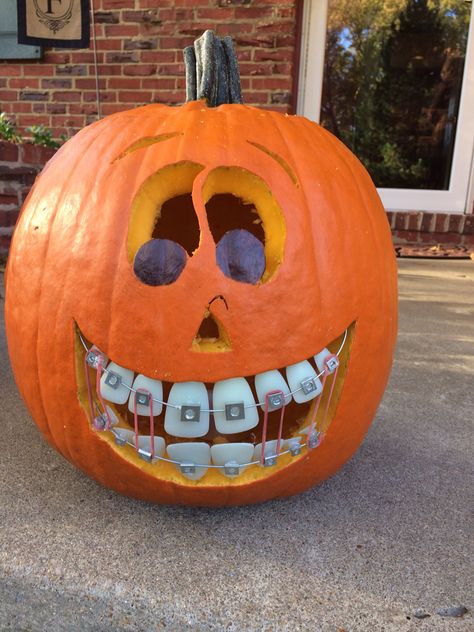 Braces pumpkin Pumpkin With Braces, Dental Themed Pumpkins, Dentist Pumpkin Ideas, Dentist Halloween Decorations, Dental Pumpkin Ideas, Halloween Braces, Brackets Ideas, Dentist Lifestyle, Pumpkin Mouth