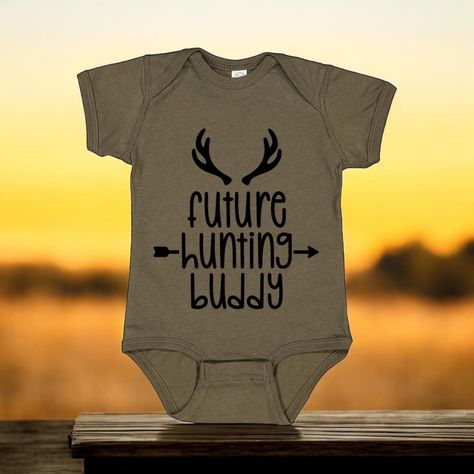 Get your little one ready for their future hunting adventures with our Hunting Buddy onesie! This adorable onesie is the perfect way to show off your love for hunting and get your little one started early. With a playful tone and cute word play, this onesie is a must-have for any hunting family. (Warning: may cause excessive cuteness) Hunting Family, Cute Word, Cute Words, Word Play, Little One, Onesies, Hunting