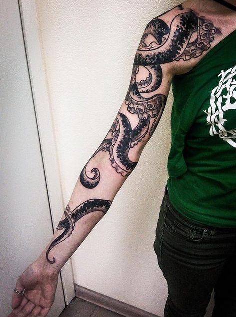 Black octopus tattoo on the right arm Wrap Around Arm Tattoo, Tentacle Tattoo, Octopus Tattoo Sleeve, Kraken Tattoo, Squid Tattoo, Around Arm Tattoo, Octopus Tattoo Design, Octopus Tattoos, Tattoos Geometric