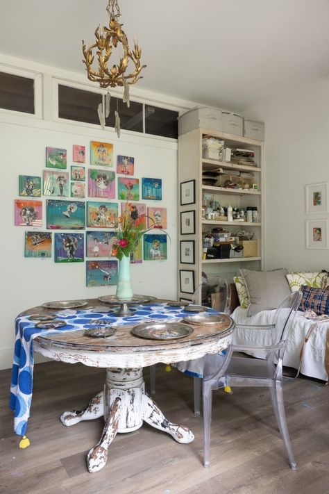 Tour This Home in Bay St. Louis With an Enchanting Backyard | Apartment Therapy Wall Of Paintings, Backyard Apartment, Eclectic Maximalist Bedroom, Bay St Louis Mississippi, Maximalist Bedrooms, Enchanting Backyard, Large Round Table, Tall Shelves, Colorful Cottage