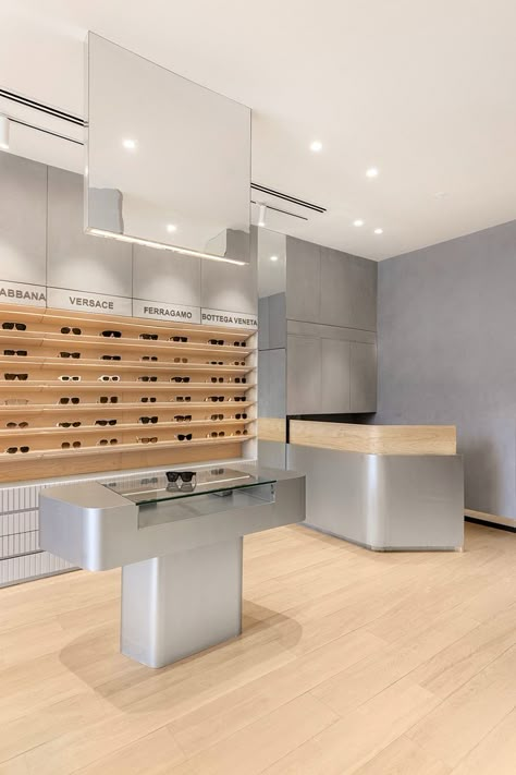 angular geometries sculpt eyewear store's interior by design i.o Retail Column Design, Sunglasses Store Design, Architectural Shelving, Wood Like Tile, Folding Architecture, Eyewear Store Design, Store Aesthetic, Japanese Joinery, Glass Store