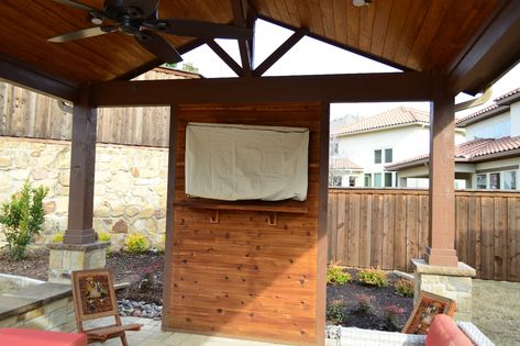 The interior of this custom cabana includes a custom cedar TV wall and cedar mantel. Gazebo Tv Ideas, Patio Tv, Irving Texas, Tv Ideas, Patio Deck Designs, Patio Fireplace, Backyard Gazebo, Deck Designs Backyard, Backyard Pavilion