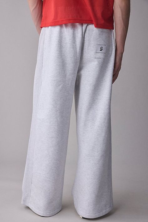 Easy wear sweatpants by the essential Standard Cloth label. Relaxed, wide leg sweatpants with a contrast stripe at the side. Urban Outfitters exclusive. Features Standard Cloth knit side stripe sweatpant Relaxed, wide leg sweatpants Elastic waistband Front & back pockets Contrast side stripe accent UO exclusive Content + Care 70% Cotton, 30% polyester Machine wash Imported Size + Fit Model in Black is 6’1" and wearing size Medium Measurements taken from size Medium Rise: 13" Inseam: 29" Leg opening: 14" | Standard Cloth Knit Side Stripe Sweatpant in Light Grey, Men's at Urban Outfitters