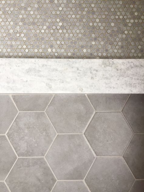 penny tile and hex flooring Gray White Bathroom Tile, Penny Tile Combination, Gray Penny Tile Bathroom Floor, Gray Hex Tile Bathroom Floor, Large Hex Tile Floor, Unique Bathroom Flooring, Warm Bathroom Tile Ideas, Gray Penny Tile Bathroom, Bathroom Floors Ideas Tile