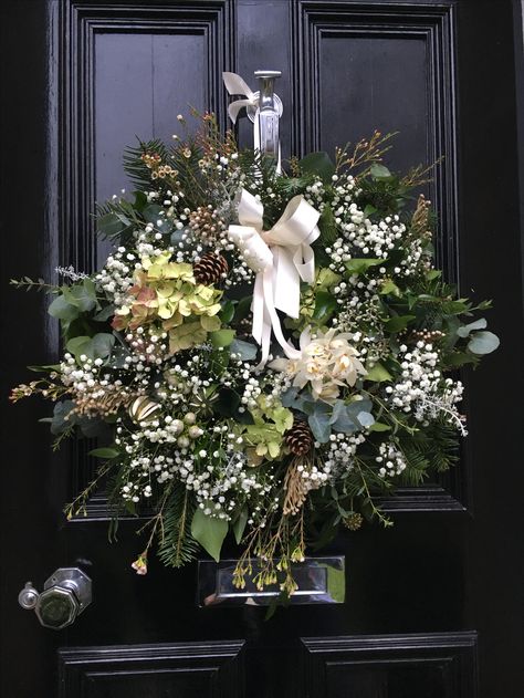 Christmas holiday wreath - white and green, pine cone, hydrangea, gypsophila, eucalyptus, wax flower, dried lime, orchid, ribbon, black front door Gypsophila Christmas Wreath, Christmas Hydrangea Wreath, Gypsophila Christmas Tree, Cone Hydrangea, January Wreath, Dried Lime, Ribbon Wreath Christmas, Black Front Door, Christmas Feast