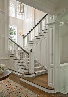 Catalano Architects | Architecture and Interior Design in Boston, MA | Boston Design Guide Beautiful Stairs Dream Homes, Open Foyer And Living Room, Open To Below Staircase, Staircase Overlooking Living Room, Big Staircase Grand Entrance, Pretty Staircases, Entrance Stairs Entryway, Turning Staircase, Rounded Stairs