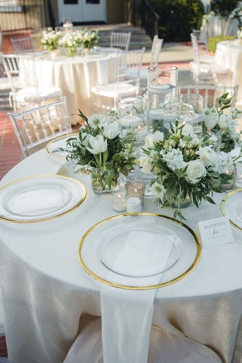 Anoosha and Kevin's color scheme for their wedding day were white, green and gold. | Photo: Naheeda Spencer Photography #weddingsinhouston #realwedding #houstonwedding #weddinginspo #weddingideas #receptiondecor #weddingreception #gardenwedding #outdoorweddingreception #weddingphotography #Indianweddings #floralcenterpieces #summerwedding Gold White Green Wedding Place Settings, Wedding Green Gold White, Green And Gold Wedding Reception, Wedding Table Settings Round, Green White Gold Wedding, White Green And Gold Wedding, Green White And Gold Wedding, Gold Wedding Decorations Receptions, Green And Gold Wedding