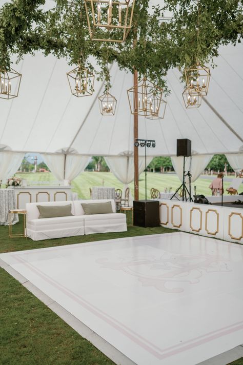 Unique lounge seating around custom vinyl dance floor with hanging greenery + lantern style chandeliers | dance floor wedding, wedding dance floor, vinyl dance floor, weddng lounge seating, lounge wedding seating area, lantern chandeliers, wedding floor lighting, tented wedding, outdoor wedding reception, wedding reception outdoor, tented wedding reception, white wedding tent, garden tented wedding, outdoor dance floor lighting, outdoor reception lighting, wedding dance floor outdoor Greenery Above Dance Floor, Wedding Tent Lounge Area, Wedding Decorations Dance Floor, Marquee Wedding Dancefloor, Dance Floor Design Wedding, Outside Wedding Dance Floor, Garden Wedding Dance Floor, Wedding Dance Floor Decorations, Vinyl Dance Floor Wedding