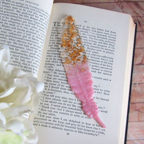 Resin Bookmarks for the book addict 😍 #indigomoon #indigomoonstudiouk #bookmark #resin #feather #bookworm #bookaddict Bookmark Resin, Resin Bookmarks, Book Addict, Resin Crafts, Book Worms, Moon, Books, On Instagram, Quick Saves